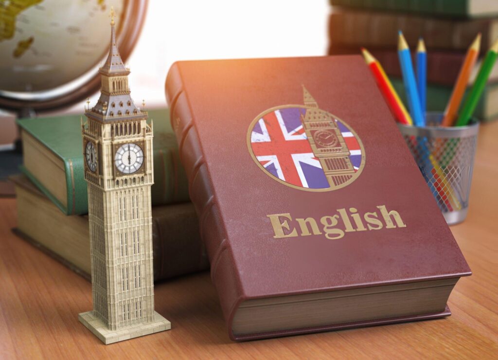 Book with flag of Great Britain and Big Ben tower on the table.